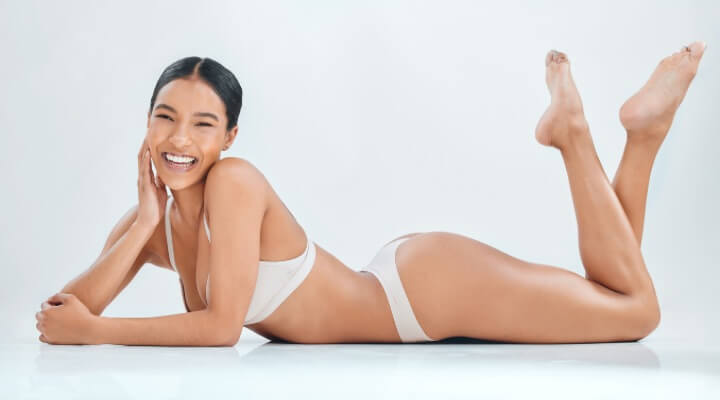 smiling woman with toned body